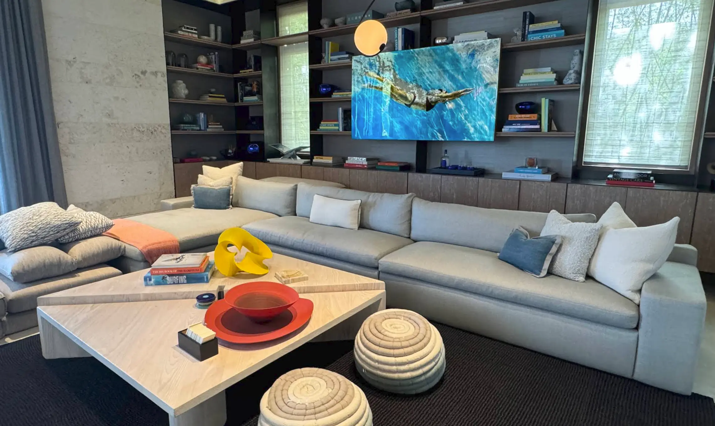 Living room hard flooring and stone wall in a Nassau home